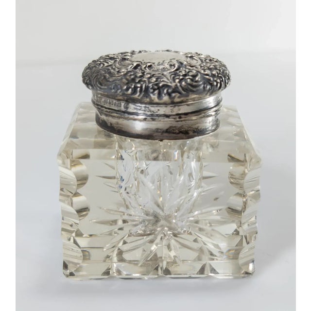 We are selling this high quality sterling silver and crystal cut glass inkwell. The Silver cover is decorated with...