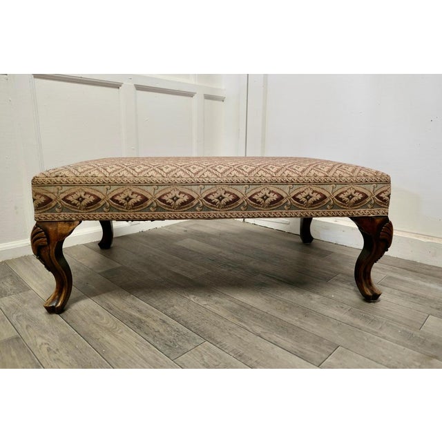 A Sturdy Walnut Upholstered Library Stool. This very attractive stool has been upholstered with a simulated Petit Point...