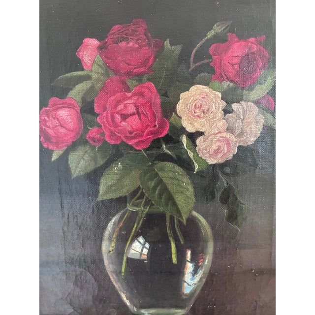 This original vintage oil painting, created around 1930, shows a bouquet of red and pink roses arranged in a clear glass...