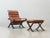 Iconic scandinavian lounge chair with matching footstool, designed by ingmar relling for the norwegian manufacturer...