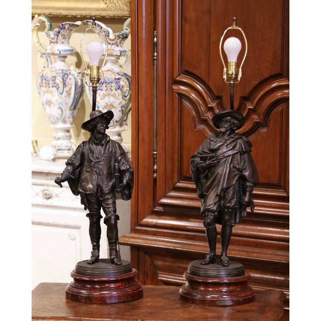 Decorate a man's office, library, or entryway with this elegant pair of antique French figural lamps, crafted circa 1870....