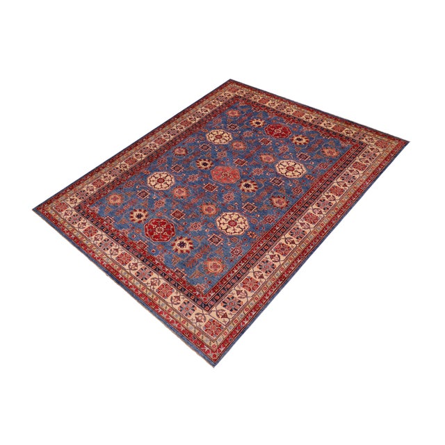 "Transform your home with this stunning hand-knotted Super Kazak rug, expertly crafted from premium hand-spun wool and...