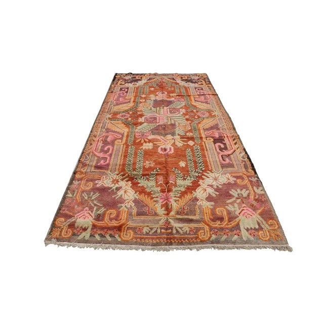Add a touch of history and color to your home with this Vintage Samarkand Floral Area Rug! Hand-knotted in Yarkand, East...