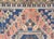 A vintage Turkish Oushak measuring 5'5" x 10'11", hand-woven with wool on wool foundation. This piece displays the...