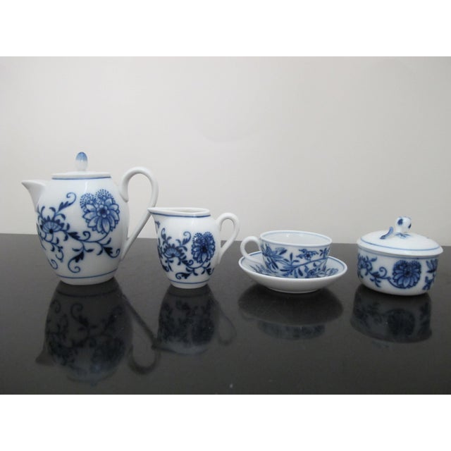 Irresistibly sweet Meissen children's tea set. White porcelain in Blue Onion pattern. Includes oval serving tray with...
