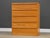 A mid century modern style oak tall dresser with a plinth base. Unmarked. Excellent condition. Circa 1980’s. Made in USA....