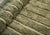 Fine ivory pinstripes trace down a richly mottled olive and sage field, giving this rug the plush, natural texture of...