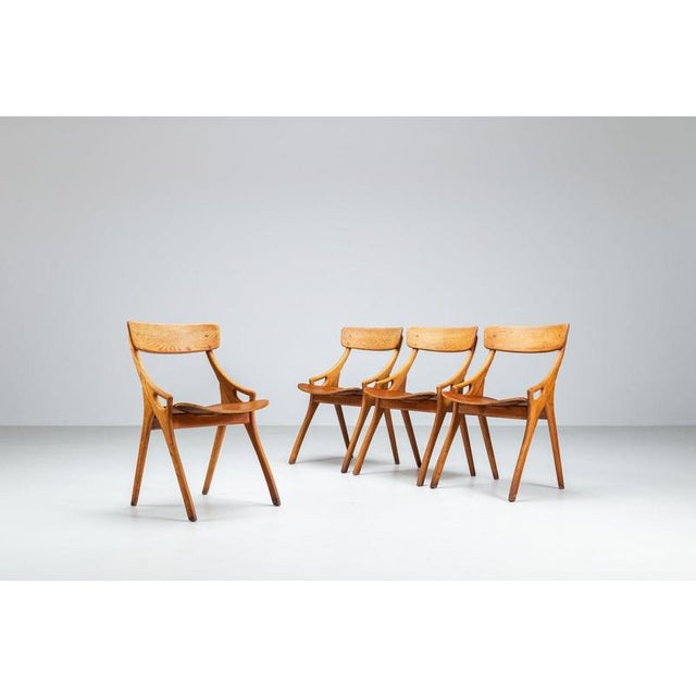 Arne Hovmand-Olsen set of four dining chairs for Mogens Kold, Denmark, 1959. Crafted in beautifully grained teak and oak,...