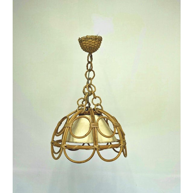 Mid Century bamboo hanging light by Louis SOGNOT, France, 1950s-1960s, made of bamboo, rattan and thick paper. Beautifully...