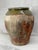 A striking, large earthenware storage jar, likely Mediterranean, dating to the late 19th or early 20th century. The vessel...