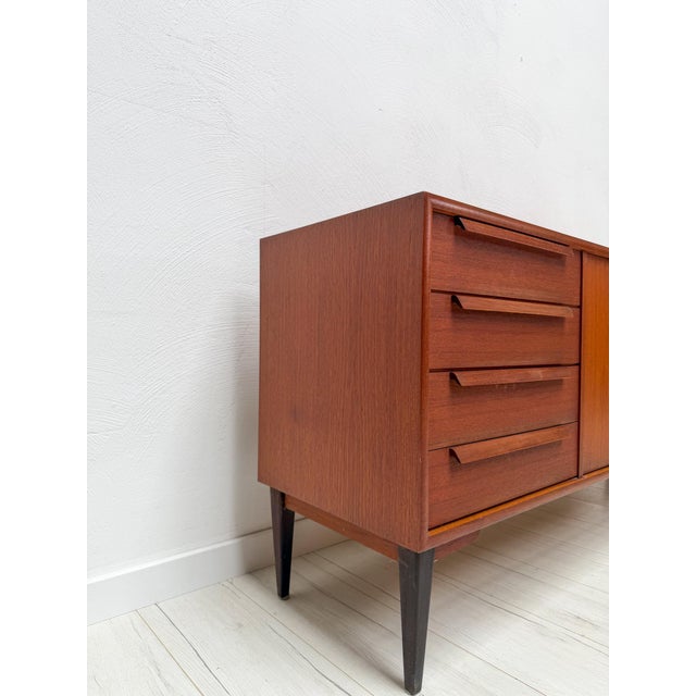 Beautiful german mid-century sideboard produced by wk möbel during the 1960s. Crafted in teak, the piece features a clean...