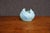 Van Briggle art pottery vase featuring a sculptural, petal-like form with sweeping raised relief and a soft blue-green...