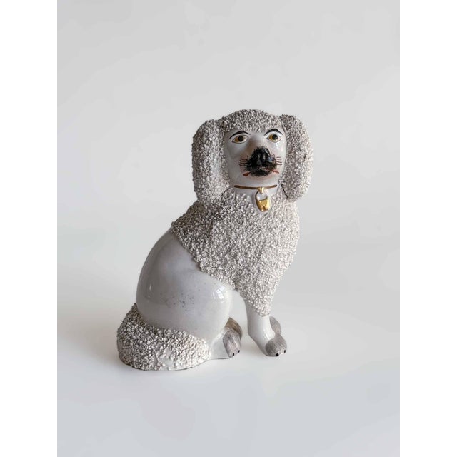 Two vintage Staffordshire style dogs (not a pair, however they are similar). Larger one has more age (please see photos).