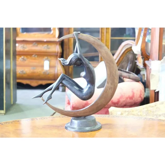 A Gorgeous French Art Nouveau style statue in bronze showing a semi nude moon girl. The Patina is superb to the bronze as...