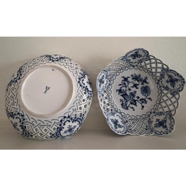 This pair of Antique Meissen Blue Onion reticulated serving dishes with crossed swords hallmark are a set of elegant and...