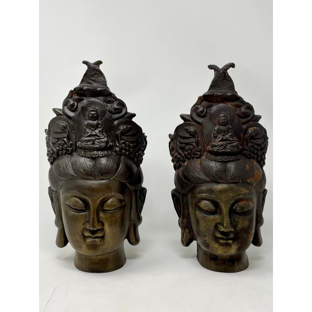 A rare pair of early 20th century cast Chinese Buddhist Guan Yin Goddess sculptural pair of cast iron head forms with gold...