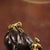 This is a charming vintage Chinese gilt bronze sculpture depicting two young boys interacting with a water buffalo. The...