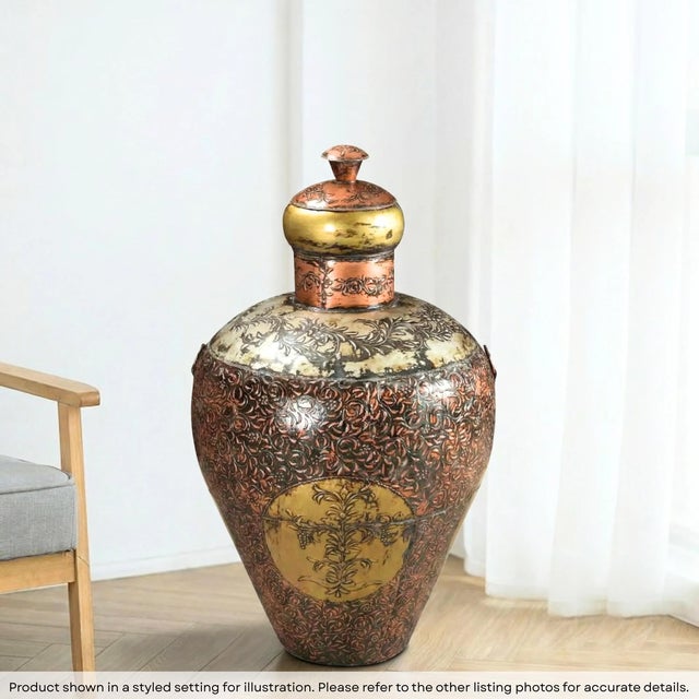 Dimensions: 22" W x 22" D x 40" H This is a vintage, hand embossed metal barrel from India. Used to store grains back in...