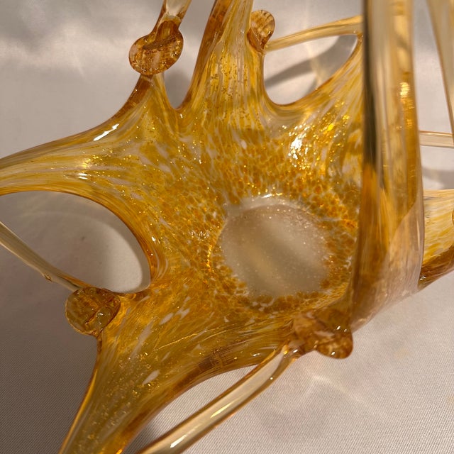 A stunning vintage Murano hand blown amber with gold fleck decorative basket bowl. This beautiful art glass bowl is About...