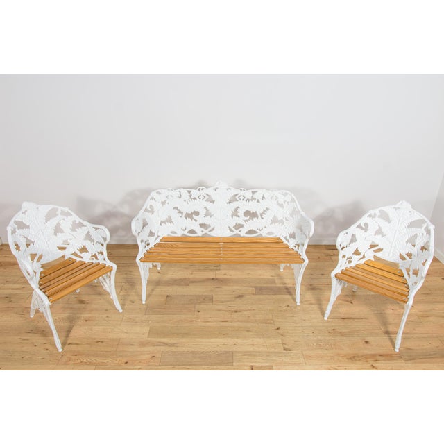 This garden furniture set was manufactured by Coalbrookdale in the United Kingdom during the 1950s and consists of a bench...