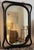 Vintage mirror with a playful black wooden frame. 54 wide x 79 high.