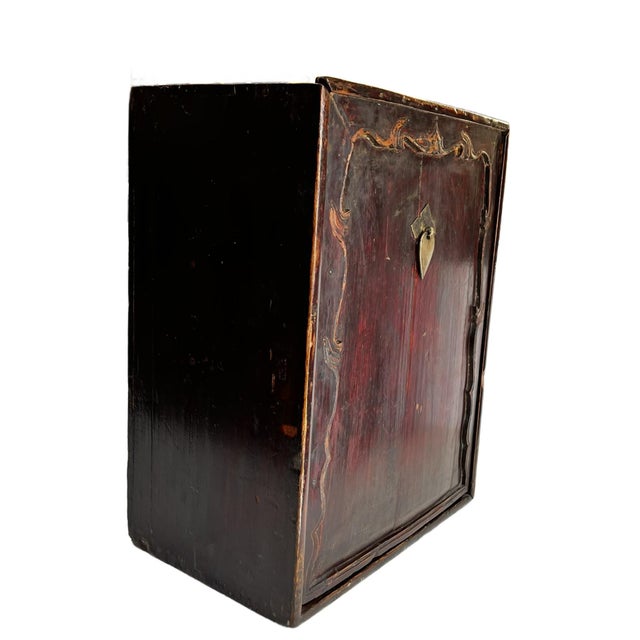 This interesting apothecary/cabinet with many drawers and a sliding door and no legs or base is a puzzle. For what purpose...