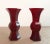 A pair of Chinese, ruby red, Peking glass gu , a finely formed, matched pair of beaker shape vases with a deep,...