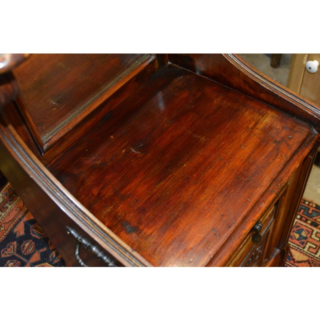 This is a great coal or log / kindling holder! I believe it is from England & possibly mahogany. Beveled mirror, carved...