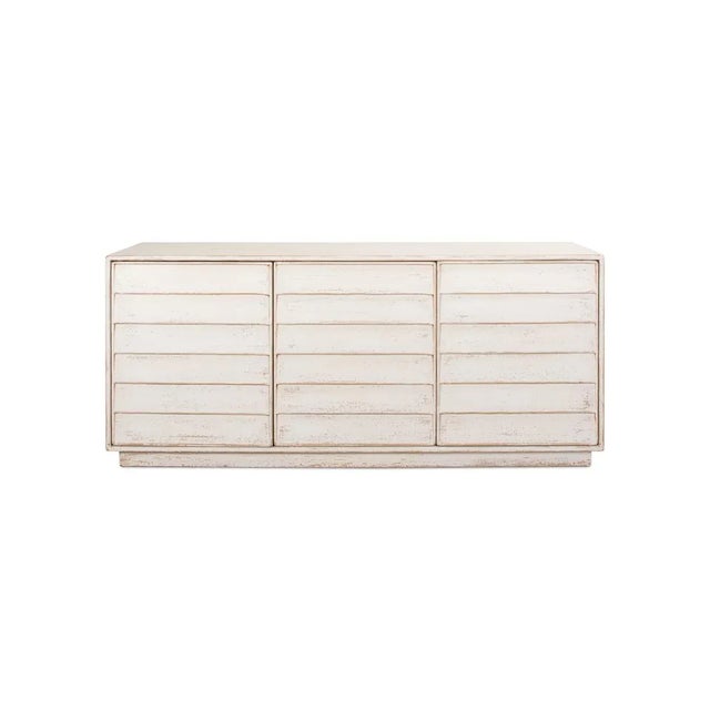 Made with reclaimed pine in an antiqued and distressed finish whitewash paint color. Three cabinet doors open to reveal a...