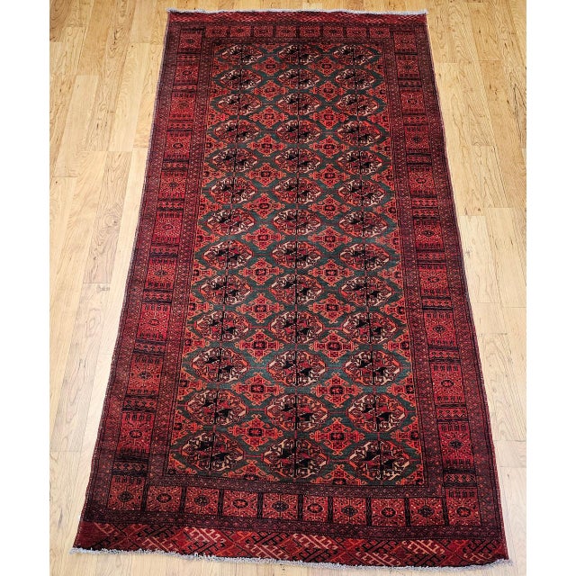 This exceptional early 20th century Turkmen tribal area rug is a rare and highly collectible example of nomadic Central...