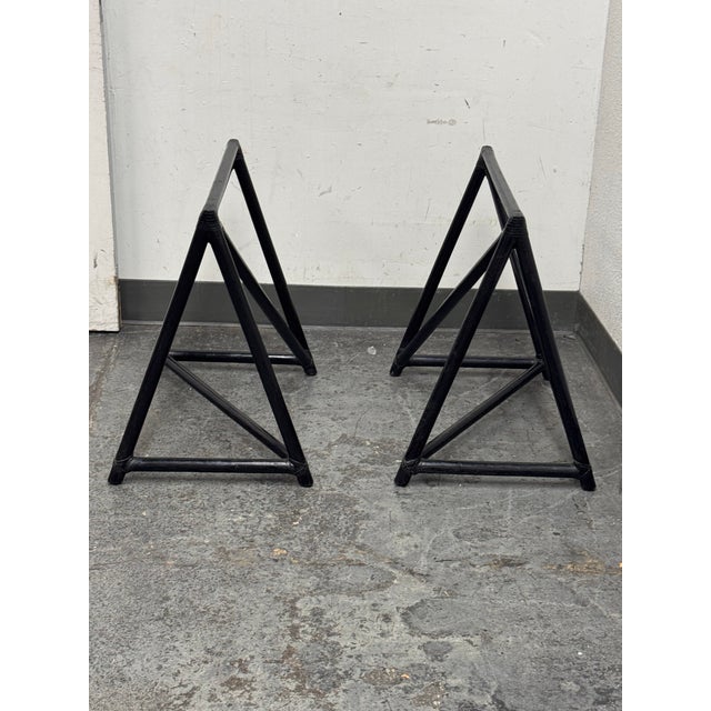 Design Plus Gallery presents a Pair of Hawkins Sawhorse Bases by McGuire Furniture. The bases have rich dark leather...