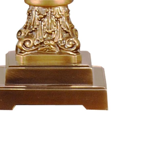 Traditional crystal column lamp featuring a cut glass pilaster with decorative antiqued brass capital and base. Top with a...