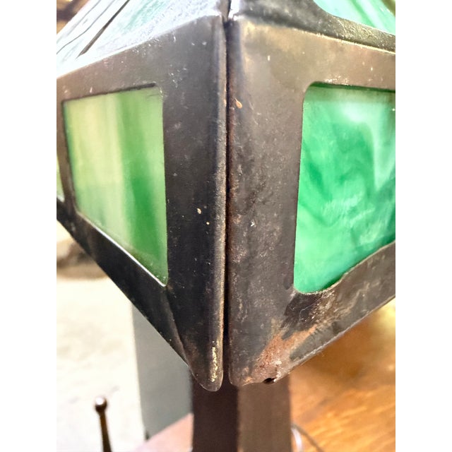 Handsome, beautiful, and classic Arts & Crafts table or desk lamp with metal and slag glass lamp shade in a fantastic warm...