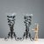 Pair of vases with a wrought iron base featuring a plant theme with leaves and flowers, a trumpet-shaped flower holder in...