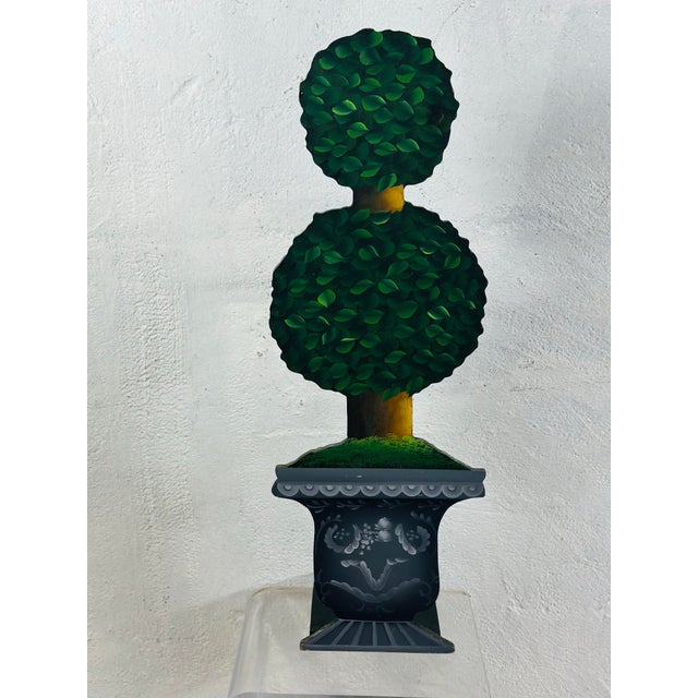 This whimsical umbrella stand is painted wood. Sturdy and functional with a fun touch!