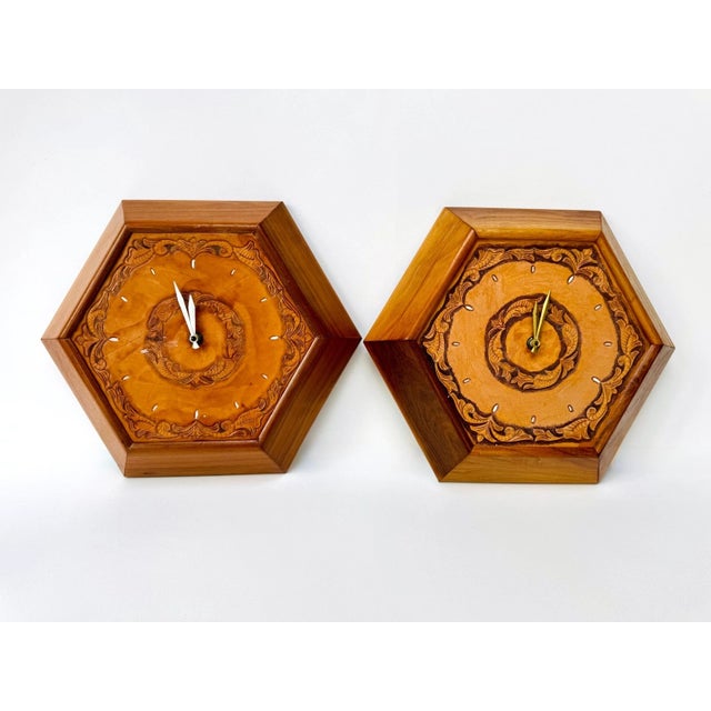 Matched pairs of hand-tooled leather wall clocks are rarely found, particularly in this size and condition. These...