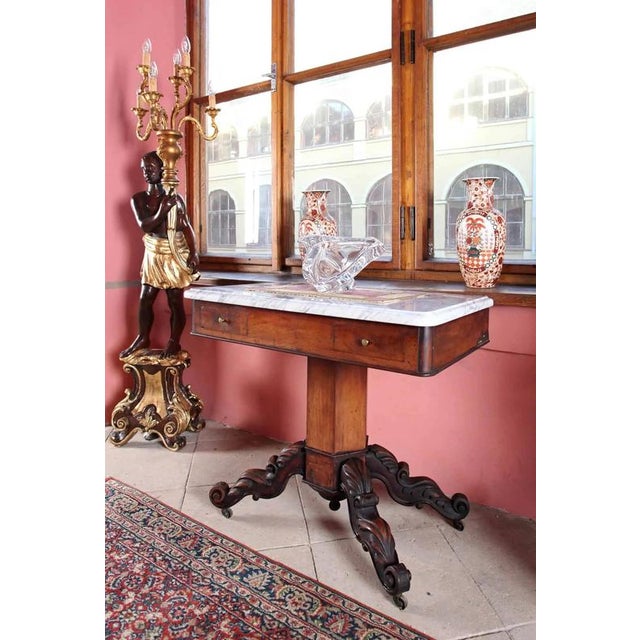 Antique table from the mid-19th century. Originally the table served as a washstand, but it has been converted into a...