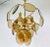 A midcentury chandelier made in Italy in the 1960s. It is fascinating with its colorful glasses and chrome body. The light...