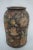 Incredible antique hand-thrown earthenware clay vessel that was profusely decorated with paper cutouts which look to be...