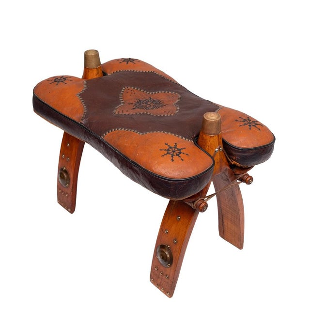 Very nice Ottoman or Foot stool. A so called camel seat. Embroiled Leather cushions. Original 1960s. So decorative.