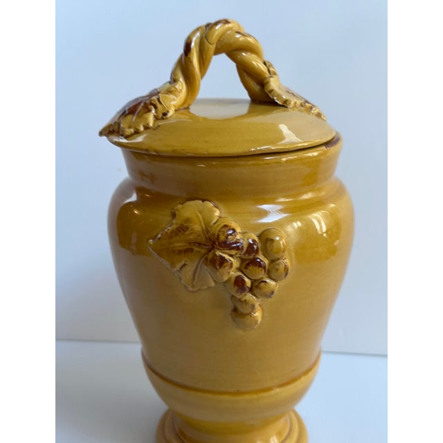 Ceramic "SOLE MUSTARD" Jar with Lid Made by Arte Italica in Italy, This Yellow Ceramic Jar Features intricate grape leaves...