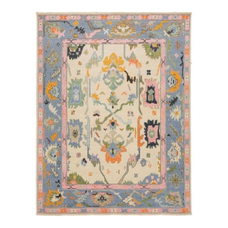 Contemporary Hand-Knotted Oushak Style Wool Rug in Ivory, Soft Blue, & Pastel For Sale