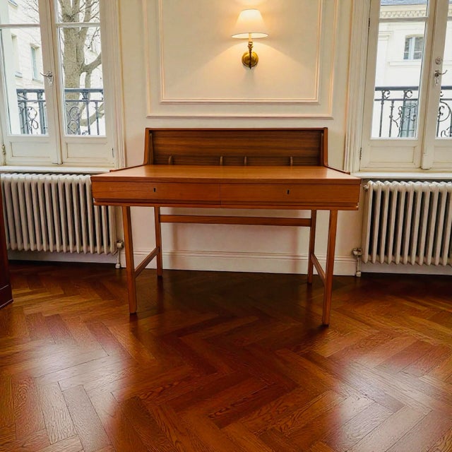Rare and exquisite flip top desk from Skaraborgs Mobelindistri Ab (Sweden). This teak example slides out to provide a...