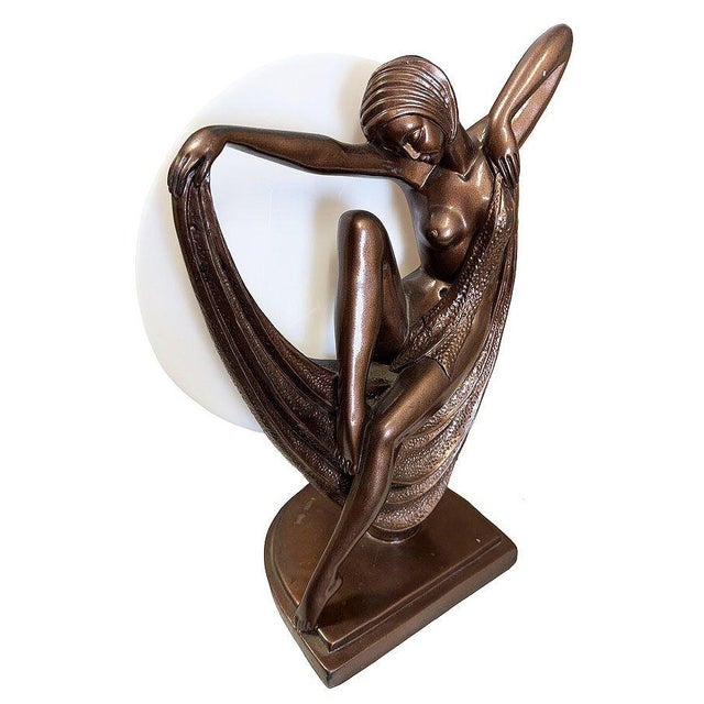 Striking and sculptural, this Art Deco–inspired nude figurative flapper table lamp by Crosa for Widdop Bingham & Co Ltd....