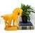 Striking vintage horse figurine crafted in glossy glazed ceramic and finished in a rich mustard yellow tone. The...