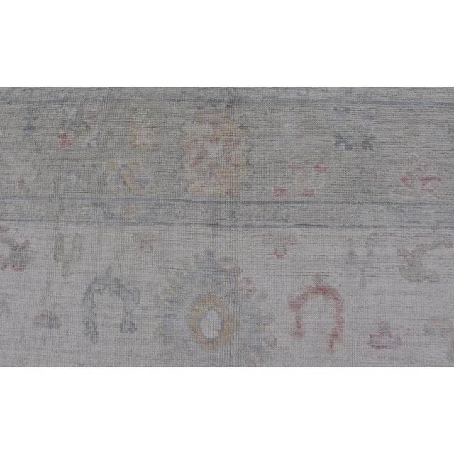 2020s Large Oushak Rug With Floral Motifs & Muted Colorful Tones on Neutral Background For Sale - Image 5 of 12