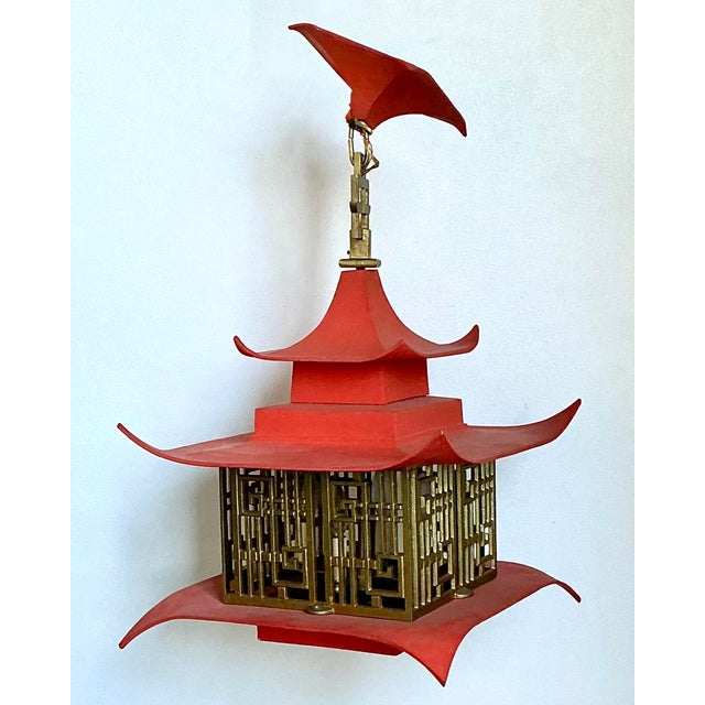This striking Mid-Century Modern pagoda lantern is a masterclass in Chinoiserie flair and architectural drama. Featuring a...