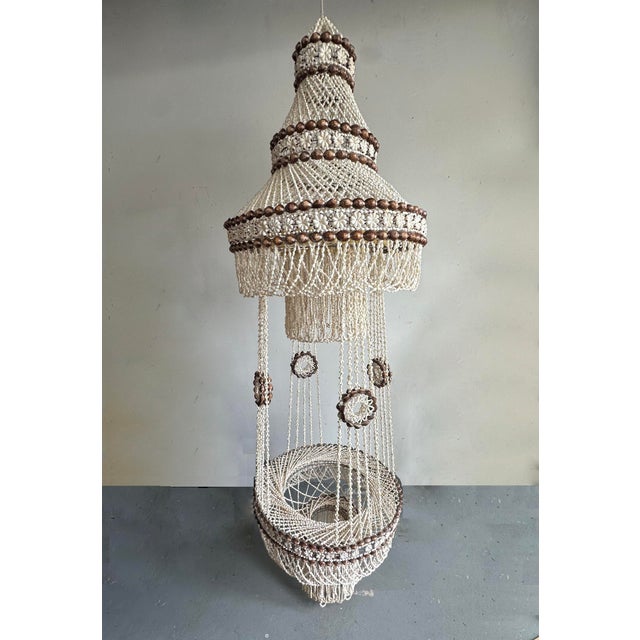 Huge floor to ceiling vintage Palm Beach/Boho cowrie shell hanging planter. String a light through the top to add drama to...