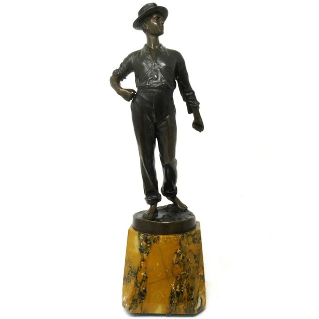 A Superb Example of a German Well Cast Figure of a young standing Gentleman on a naturalistic circular base. Late...
