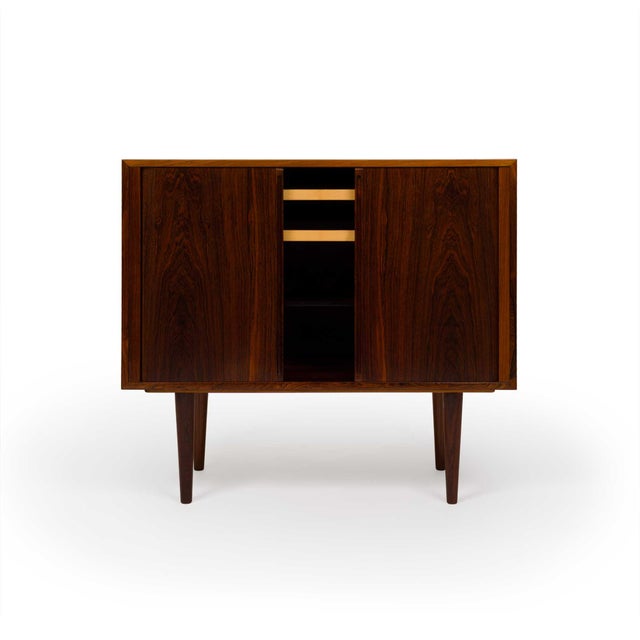 Kai Kristiansen is a renowned Danish furniture designer, celebrated for his contribution to the mid-century modern...